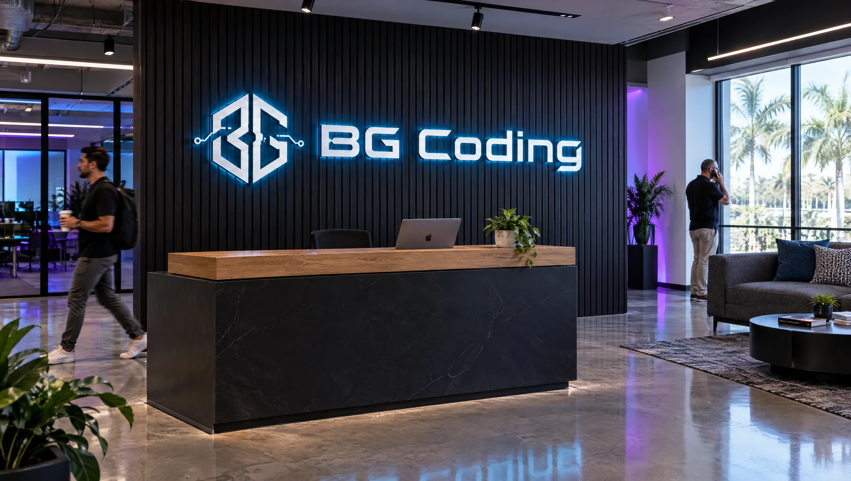 Recepción de BG Coding con el logo retroiluminado en la pared